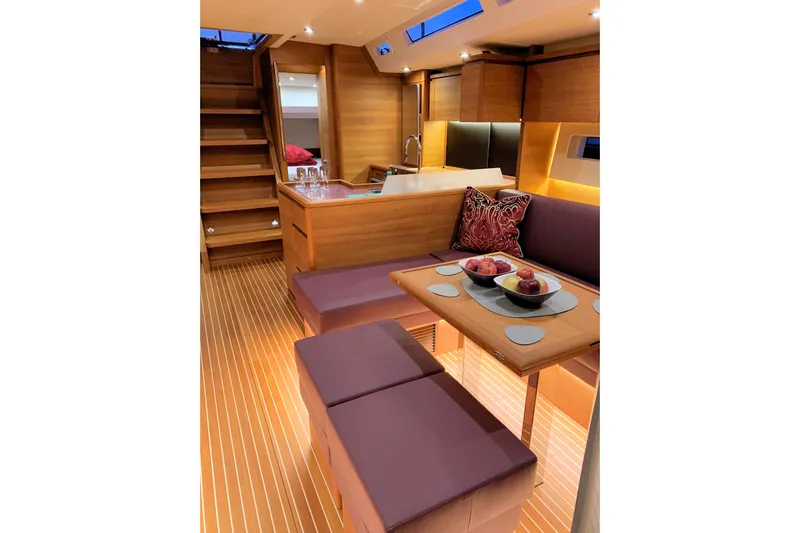 Nausicaä Yacht Photos Pics Luxurious interior of 2019 Solaris Yachts 55 with elegant wood finish and modern seating.