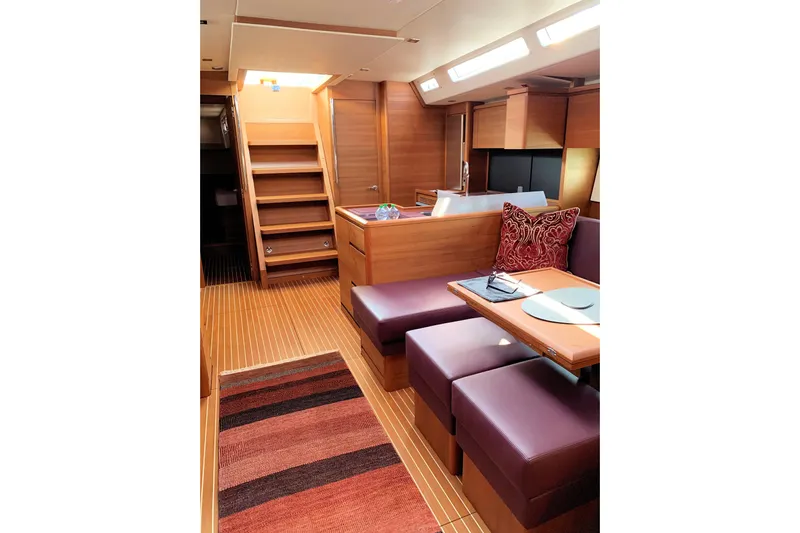 Nausicaä Yacht Photos Pics Luxurious interior of 2019 Solaris Yachts 55 with elegant wood finish and cozy seating.