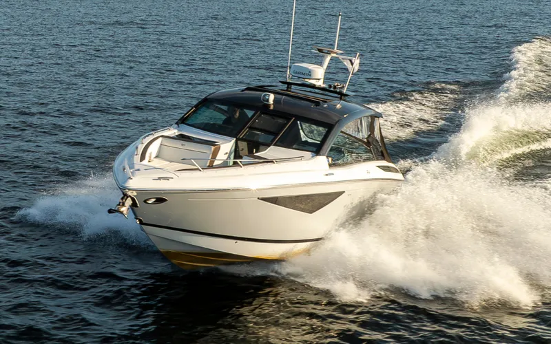 Rancho Agua Yacht Photos Pics 2021 Cobalt A36 boat cruising swiftly on open water.