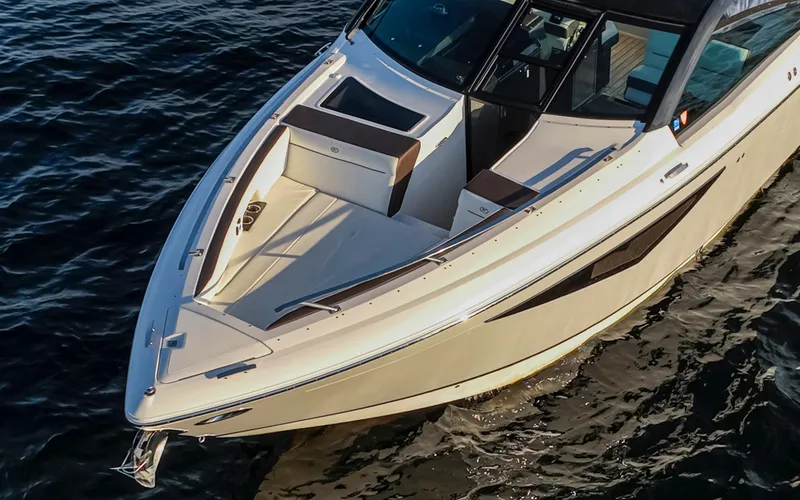 Rancho Agua Yacht Photos Pics 2021 Cobalt A36 boat on water, showcasing sleek design and spacious deck.