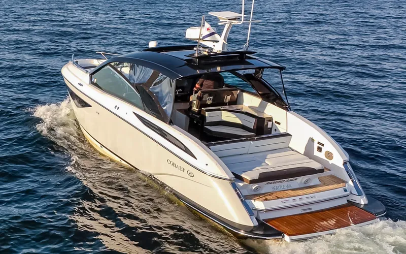 Rancho Agua Yacht Photos Pics 2021 Cobalt A36 boat cruising on open water, showcasing sleek design and luxury features.