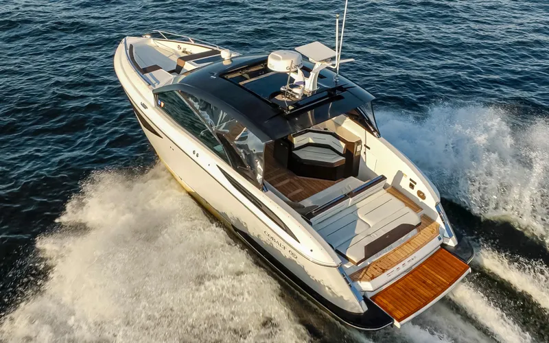 Rancho Agua Yacht Photos Pics 2021 Cobalt A36 boat cruising on open water, showcasing sleek design and luxury features.