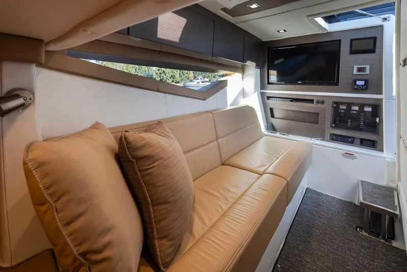 Rancho Agua Yacht Photos Pics Interior of 2021 Cobalt A36 boat with beige leather seating and modern entertainment system.