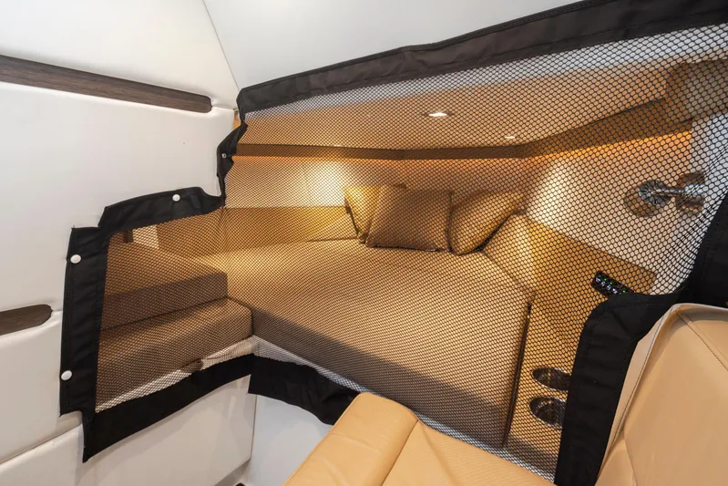 Rancho Agua Yacht Photos Pics 2021 Cobalt A36 cabin interior with beige seating and netting.