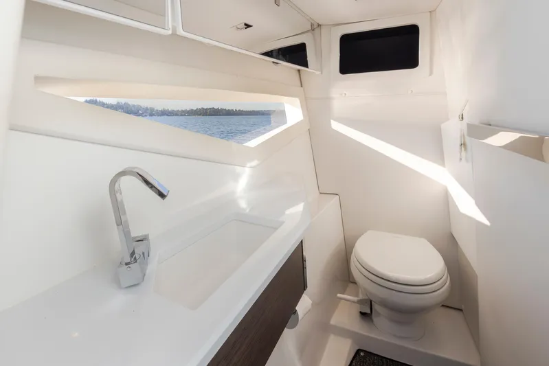Rancho Agua Yacht Photos Pics Modern bathroom interior on 2021 Cobalt A36 boat with sink and toilet.