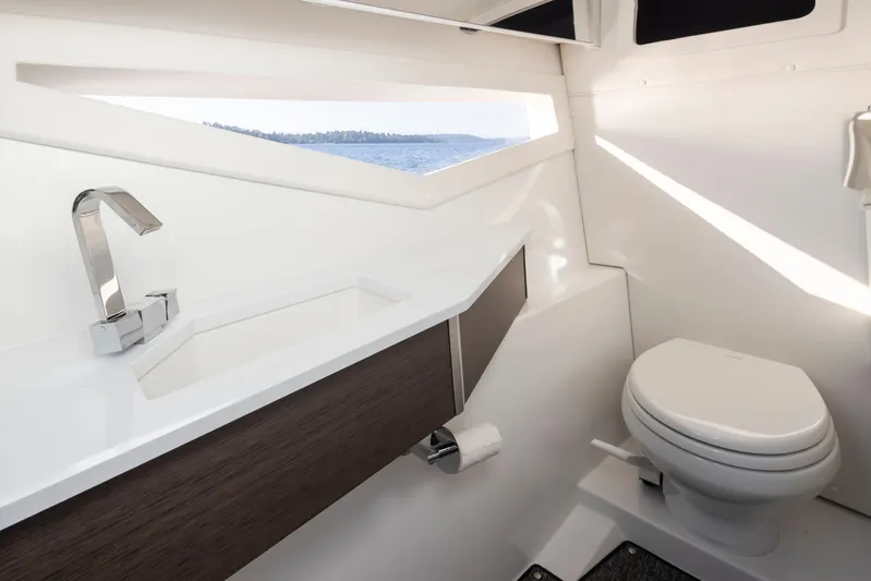 Rancho Agua Yacht Photos Pics Modern bathroom interior on 2021 Cobalt A36 boat with sleek design and ocean view.