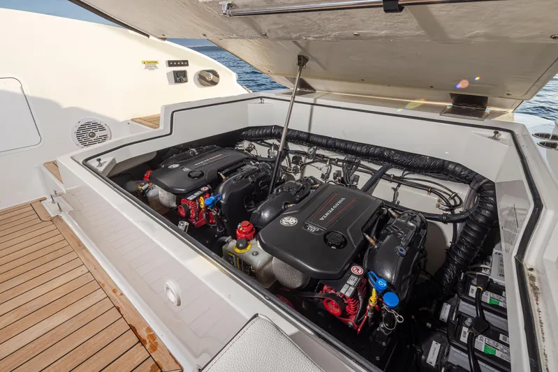 Rancho Agua Yacht Photos Pics Engine compartment of a 2021 Cobalt A36 boat, showcasing dual engines and battery setup.