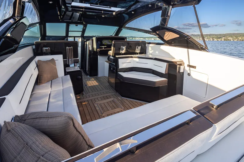 Rancho Agua Yacht Photos Pics Luxurious 2021 Cobalt A36 yacht interior with elegant seating and scenic ocean view.
