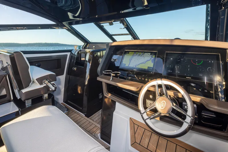 Rancho Agua Yacht Photos Pics Helm of 2021 Cobalt A36 boat with modern navigation displays and steering wheel.