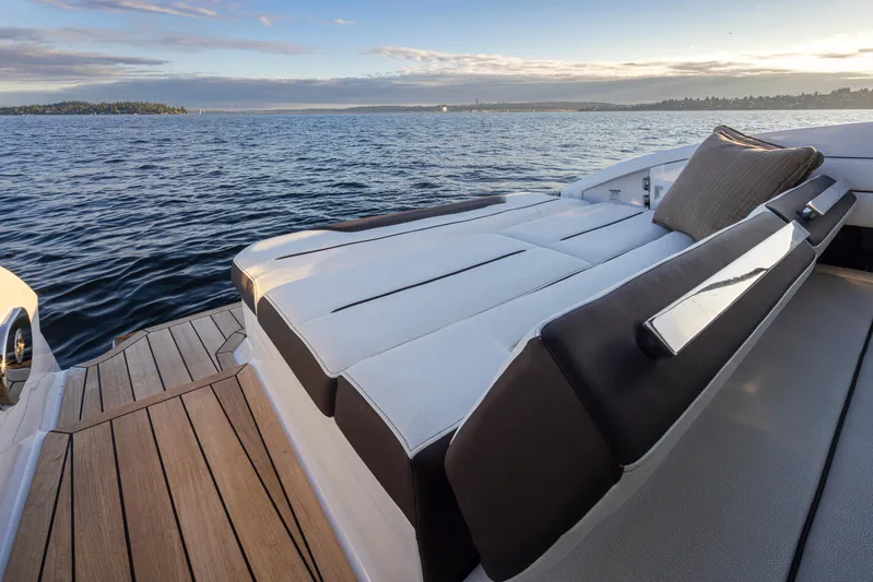 Rancho Agua Yacht Photos Pics Luxury Cobalt A36 boat with sunbed, 2021 model, on serene water at sunset.