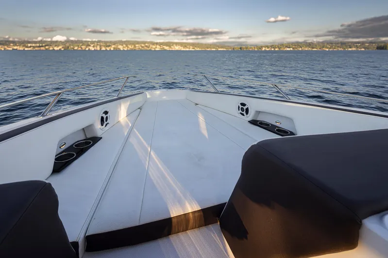 Rancho Agua Yacht Photos Pics 2021 Cobalt A36 boat bow view on calm water, featuring sleek design and cup holders.