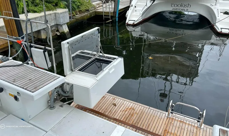  Yacht Photos Pics Beneteau Oceanis 51.1 yacht docked, showcasing open storage compartment, 2024 model.