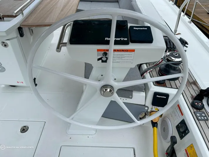  Yacht Photos Pics Steering wheel of 2024 Beneteau Oceanis 51.1 yacht with Raymarine equipment.