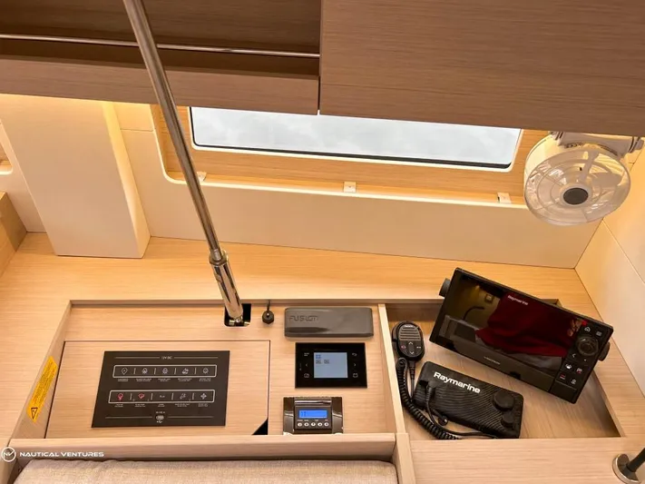  Yacht Photos Pics Interior of 2024 Beneteau Oceanis 51.1 yacht with navigation equipment and control panel.