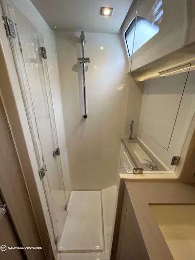  Yacht Photos Pics 2024 Beneteau Oceanis 51.1 yacht bathroom with modern shower and sleek design.