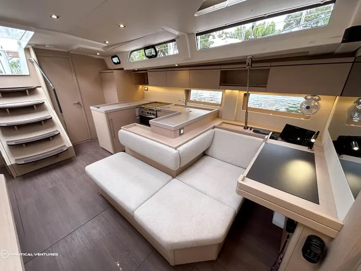  Yacht Photos Pics Luxurious interior of 2024 Beneteau Oceanis 51.1 yacht with modern furnishings and ample natural light.
