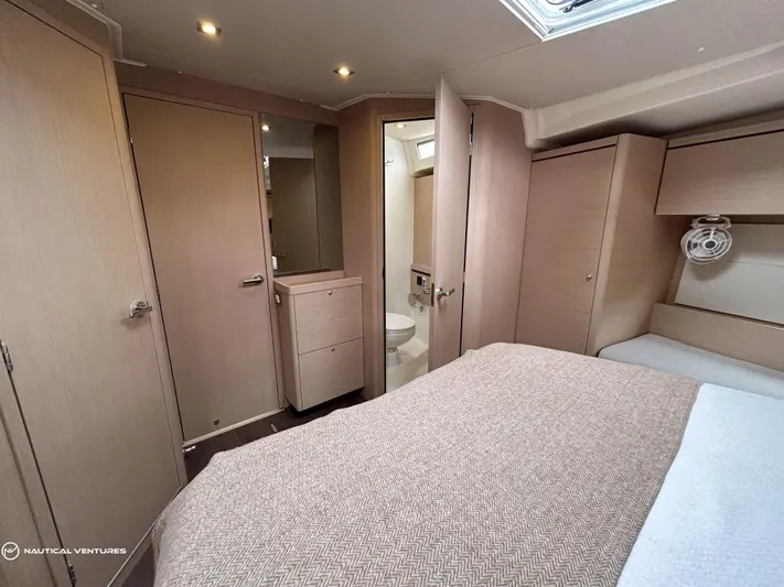  Yacht Photos Pics Luxurious cabin interior of 2024 Beneteau Oceanis 51.1 yacht with modern furnishings.