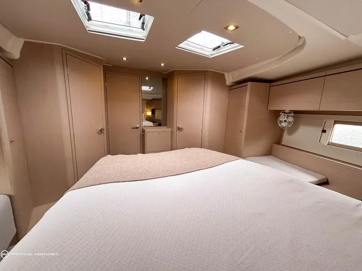  Yacht Photos Pics Luxurious cabin interior of 2024 Beneteau Oceanis 51.1 yacht with skylights and modern design.