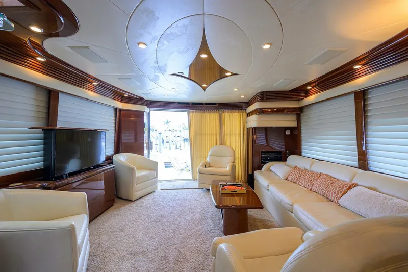Vol Aboard Yacht Photos Pics Luxurious interior of a 2005 Marquis 65 MY yacht with elegant seating and modern decor.