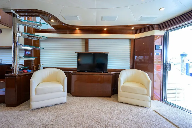 Vol Aboard Yacht Photos Pics Luxurious interior of 2005 Marquis 65 MY yacht with plush seating and modern decor.