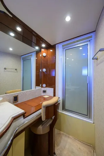 Vol Aboard Yacht Photos Pics Luxurious bathroom interior of a 2005 Marquis 65 MY yacht with modern fixtures.