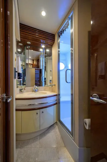 Vol Aboard Yacht Photos Pics Luxurious bathroom in 2005 Marquis 65 MY yacht with modern fixtures and elegant design.