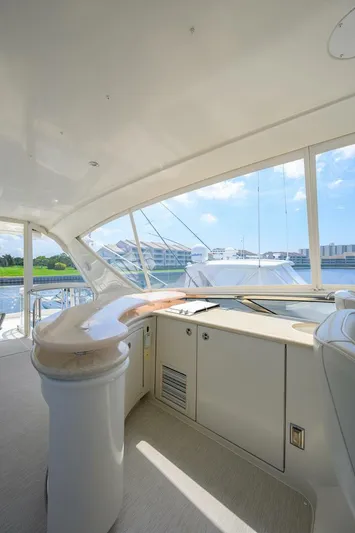 Vol Aboard Yacht Photos Pics Luxurious interior of 2005 Marquis 65 MY yacht with panoramic windows and sleek design.