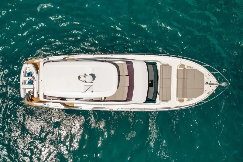 Macu Yacht Photos Pics Aerial view of 2024 Ferretti Yachts 580 on clear blue water.