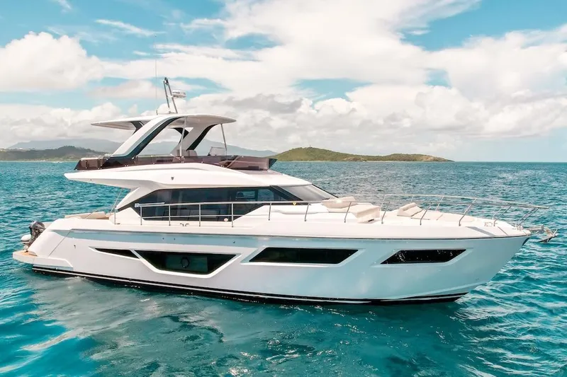 Macu Yacht Photos Pics 2024 Ferretti Yachts 580 cruising on clear blue ocean waters.