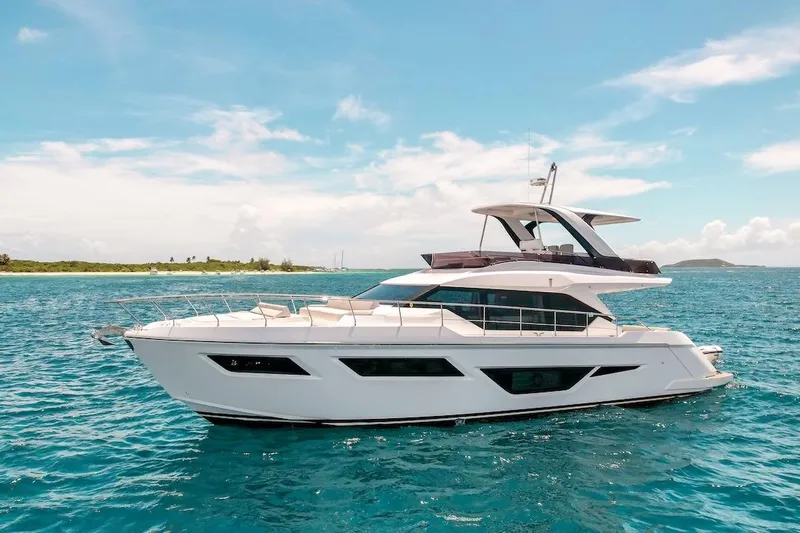 Macu Yacht Photos Pics 2024 Ferretti Yachts 580 cruising on clear blue waters under a sunny sky.