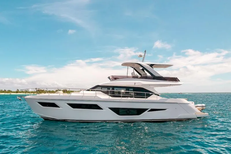 Macu Yacht Photos Pics 2024 Ferretti Yachts 580 cruising on clear blue ocean under a sunny sky.