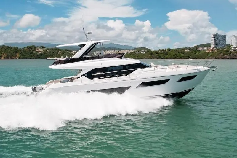 Macu Yacht Photos Pics 2024 Ferretti Yachts 580 cruising on turquoise waters under a clear blue sky.