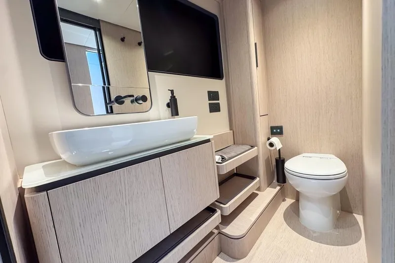 Macu Yacht Photos Pics Luxurious bathroom in 2024 Ferretti Yachts 580, featuring modern sink and toilet.