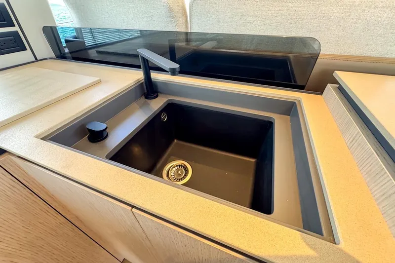Macu Yacht Photos Pics Modern kitchen sink on 2024 Ferretti Yachts 580, featuring sleek design and high-end fixtures.