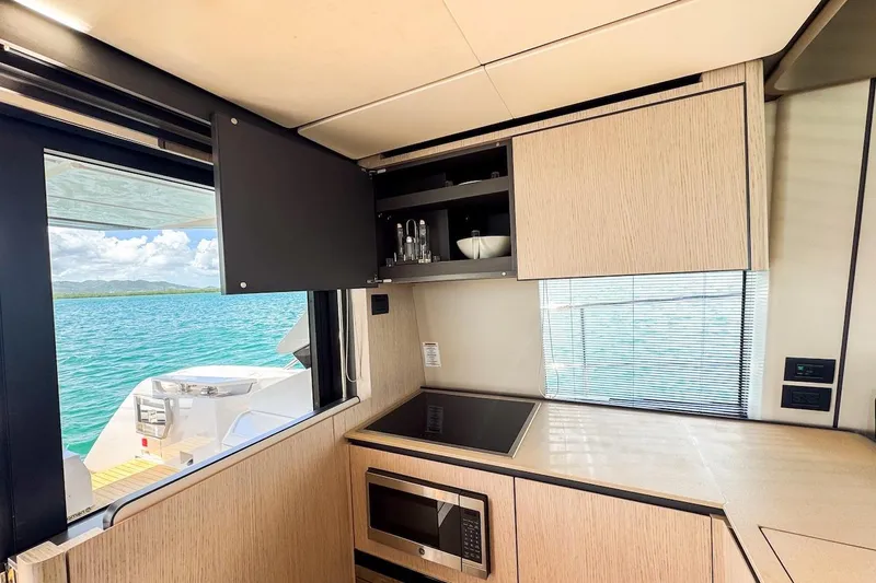 Macu Yacht Photos Pics Modern kitchen interior on 2024 Ferretti Yachts 580 with ocean view.