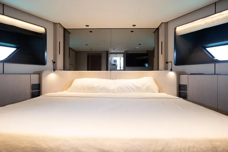 Macu Yacht Photos Pics Luxurious bedroom interior of 2024 Ferretti Yachts 580, featuring modern design and ambient lighting.