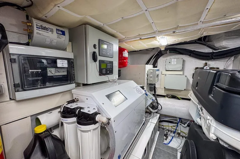 Macu Yacht Photos Pics Engine room of 2024 Ferretti Yachts 580, featuring control panels and filtration systems.