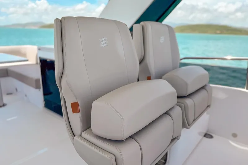 Macu Yacht Photos Pics Luxury seating on 2024 Ferretti Yachts 580, overlooking serene ocean view.