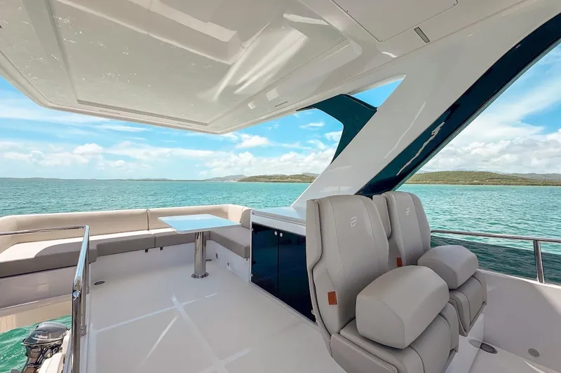 Macu Yacht Photos Pics Luxurious 2024 Ferretti Yachts 580 interior with ocean view and elegant seating.