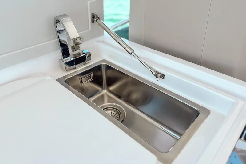 Macu Yacht Photos Pics Stainless steel sink on 2024 Ferretti Yachts 580, featuring modern faucet design.
