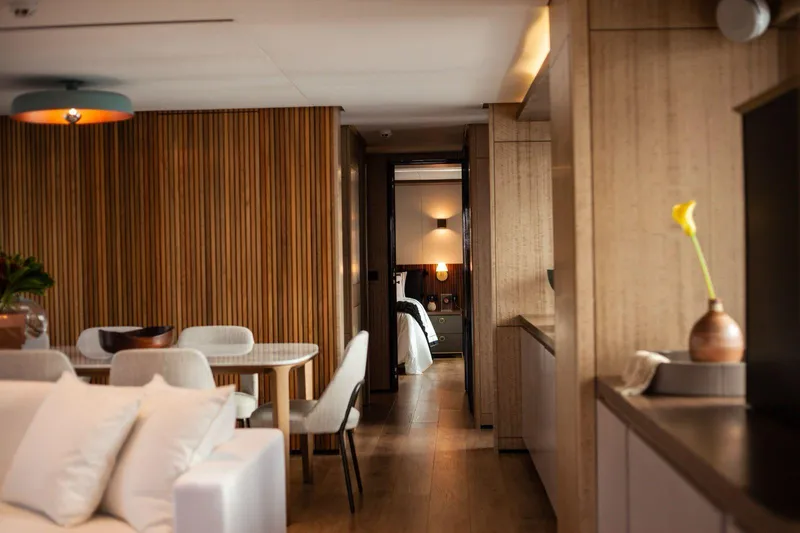  Yacht Photos Pics Luxurious interior of 2027 Inace Explora 90 yacht with modern dining and living area.