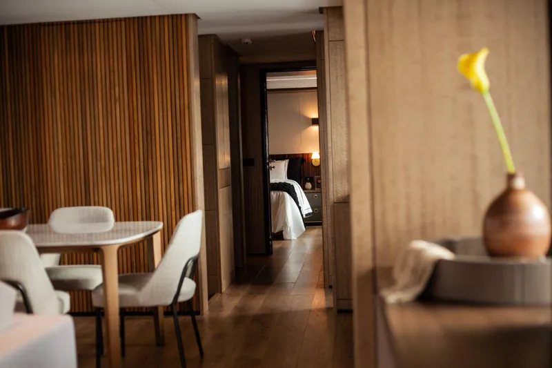  Yacht Photos Pics Luxurious interior of Inace Explora 90 yacht, featuring elegant dining area and cozy bedroom, 2027 model.