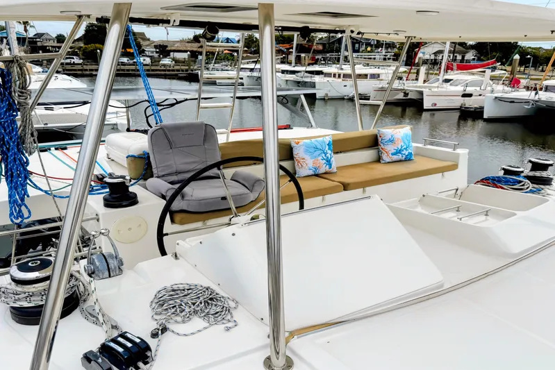  Yacht Photos Pics Lagoon 450 F 2012 catamaran with helm, seating, and marina view.