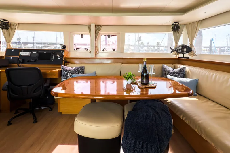  Yacht Photos Pics Luxurious interior of 2012 Lagoon 450 F yacht with elegant dining area and navigation station.