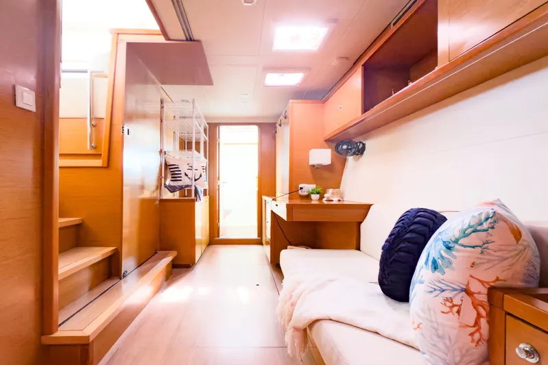  Yacht Photos Pics Interior of 2012 Lagoon 450 F yacht, featuring cozy seating and modern wooden design.