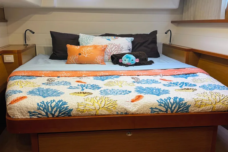  Yacht Photos Pics Cozy bedroom in 2012 Lagoon 450 F yacht with colorful coral-themed bedding.