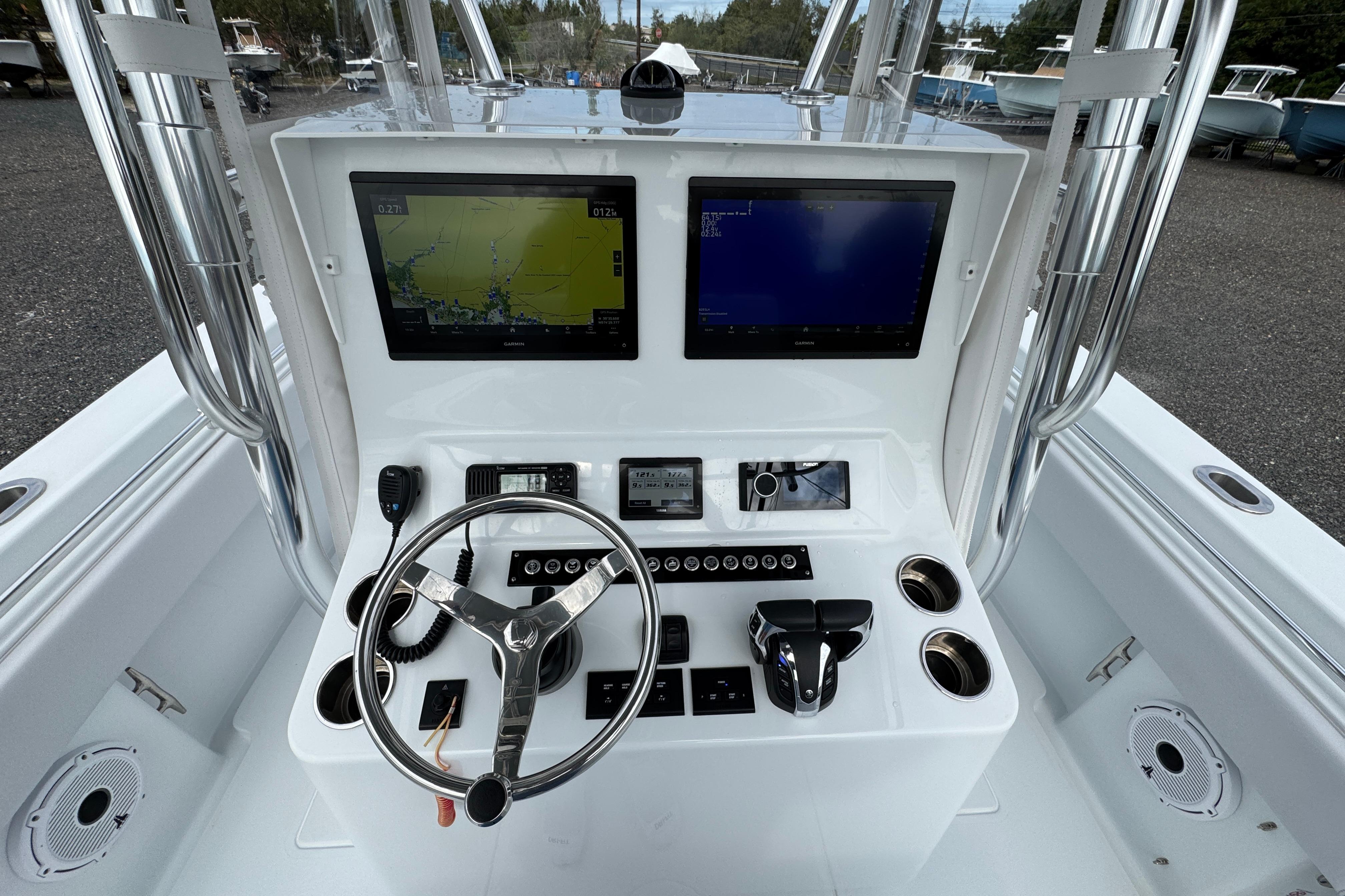 Center console of 2022 Contender 32 ST boat with navigation screens and controls.
