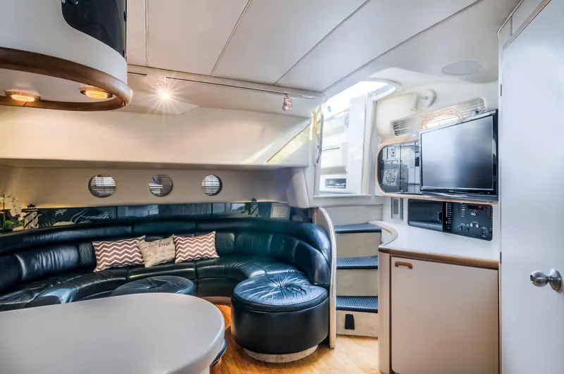  Yacht Photos Pics Luxurious interior of a 1994 Sea Ray 500 Sundancer yacht with leather seating and modern amenities.