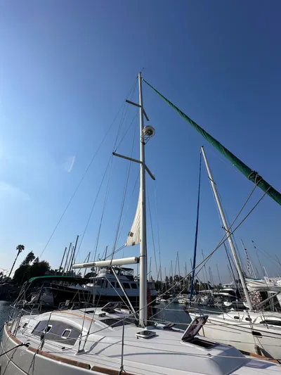 Shamrock Yacht Photos Pics 2011 Beneteau Oceanis 40 sailboat docked under clear blue sky.
