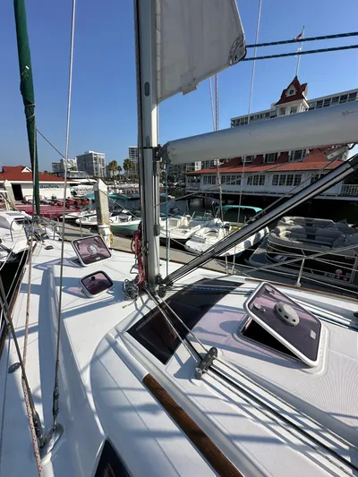 Shamrock Yacht Photos Pics 2011 Beneteau Oceanis 40 sailboat docked at marina with clear blue sky.